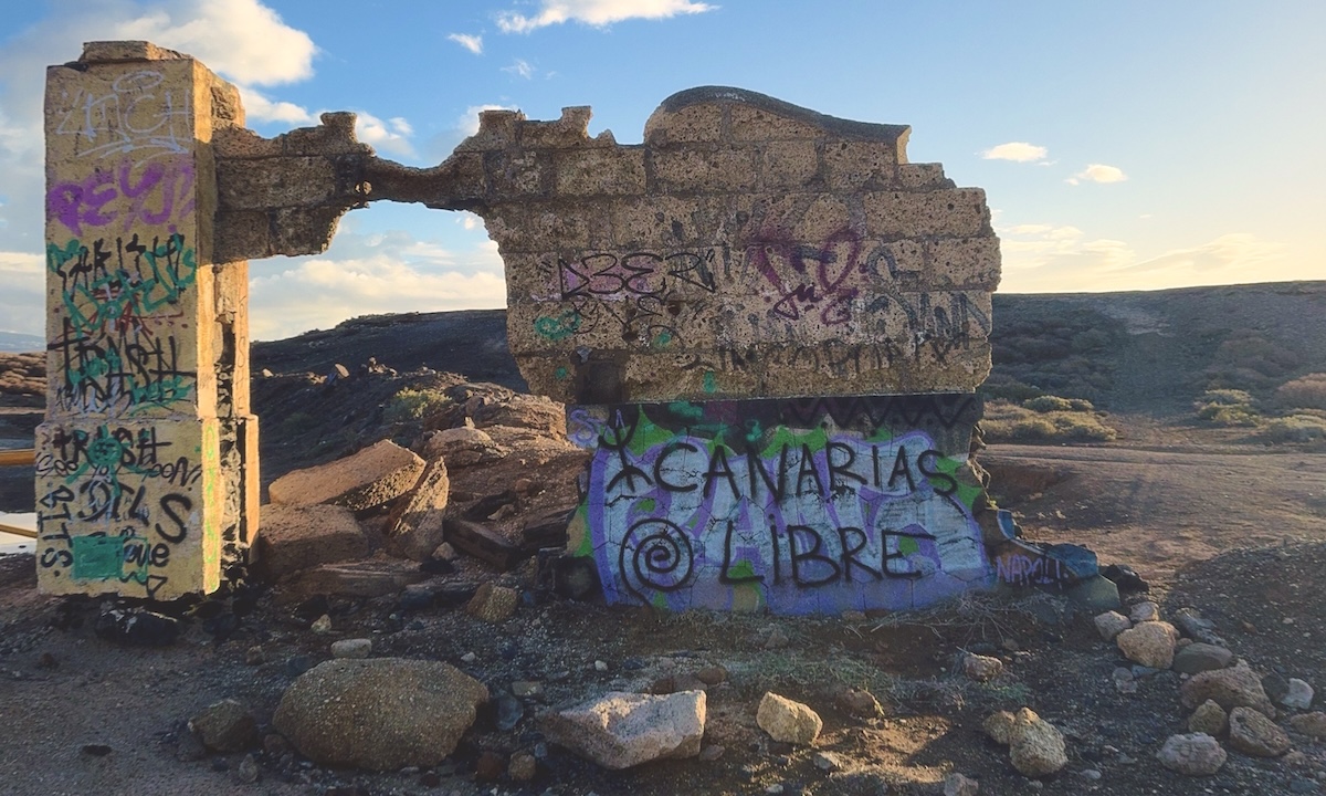 A wall with a 'free the canary's' written on it.