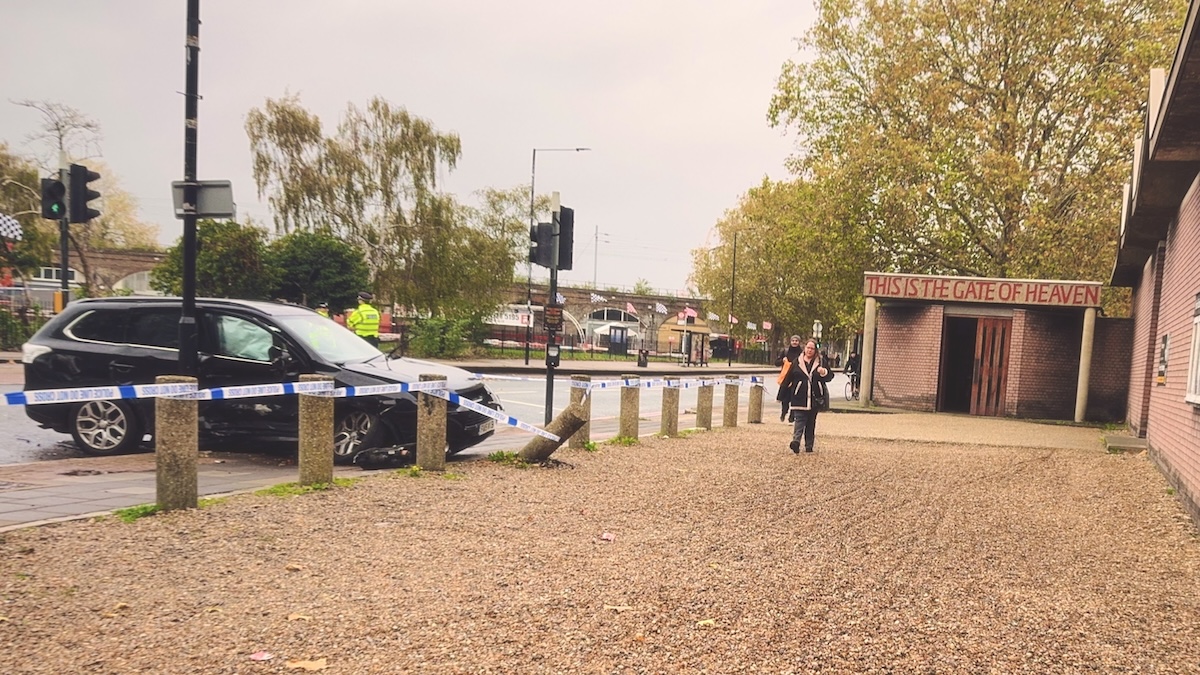 A police line cordens off a recent car crash