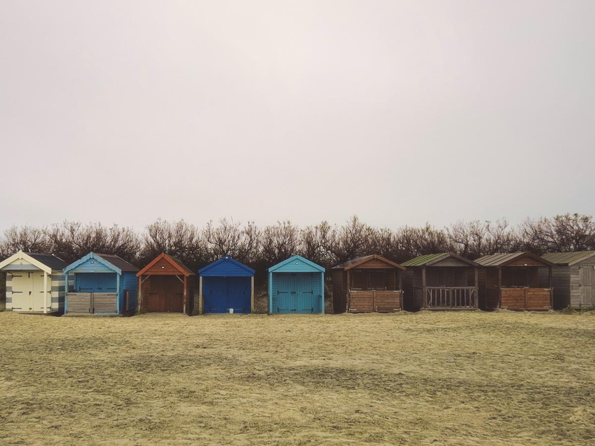 Colourful beach huts in West Wittering, England.